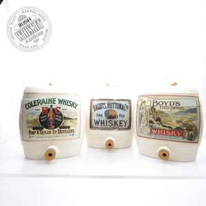 65716041_Collection_of_Three_Branded_Whisky_Porcelain_Barrel_Decanters-1.jpg